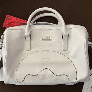 Sprayground mini duffle bag with matching pouch